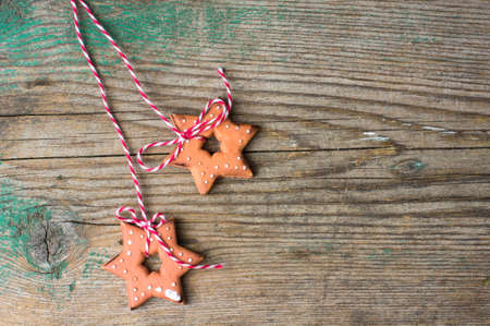 Gingerbread cookies on the old wooden backgroundの写真素材