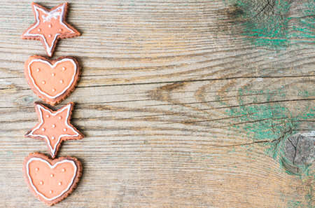 Gingerbread cookies on the old wooden backgroundの写真素材