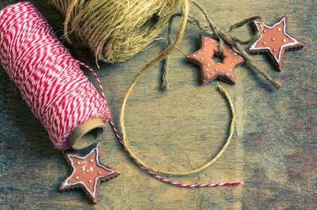 Decorative handmade ribbon on wooden background. Selective focus. Toned imageの写真素材