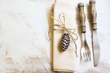 Christmas table setting with vintage silverware and napkin with christmas balls decorationsの写真素材