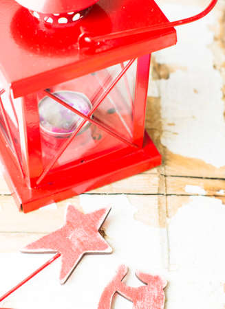 Christmas time interior decorations on the rustic background with candle lamp and fir treeの写真素材