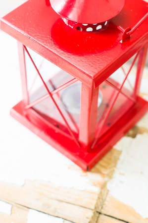 Christmas time interior decorations on the rustic background with candle lamp and fir treeの写真素材