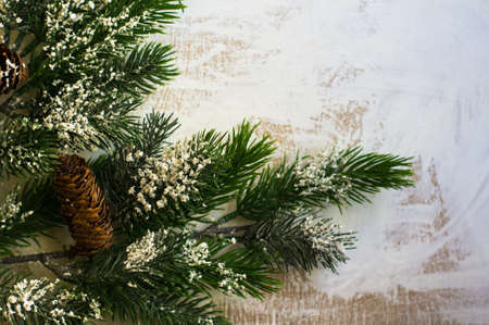Christmas time decorations and fir tree on old white wooden tableの写真素材