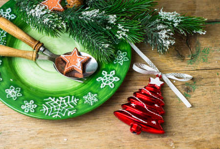 Christmas time table setting with vintage silverware on plate and napkin.の写真素材