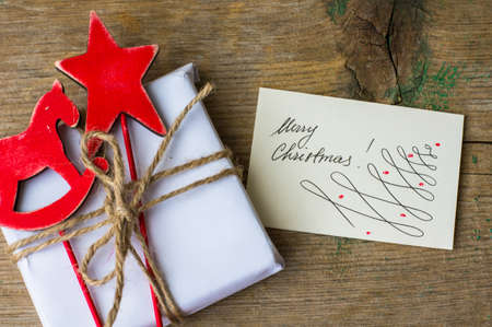 Christmas presents in rustic style with holiday decorations, selective focus