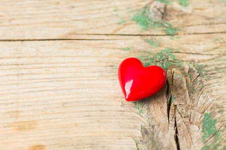 Red heart on the old wooden bacground, card for Valentines dayの写真素材