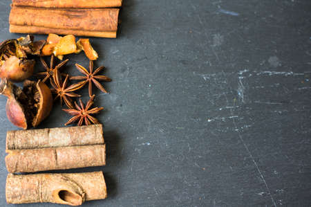 Traditional Christmas spices like a cinnamon sticks, anise stars and dried orangeの写真素材