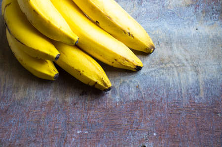 Fresh bananas on vintage wooden tableの写真素材