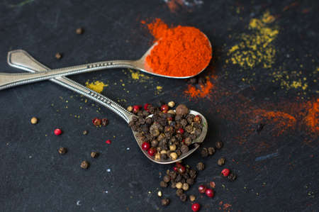 Paprika pepper spices and vintage silverware on rustic backgroundの写真素材