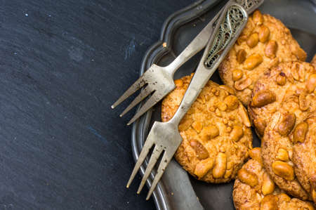 Homemade Cookies with Macadamia nuts on vintage plateの写真素材