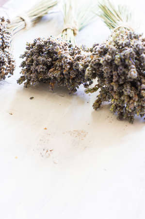 Bunch of dried lavender herb on wooden rustic backgroundの写真素材