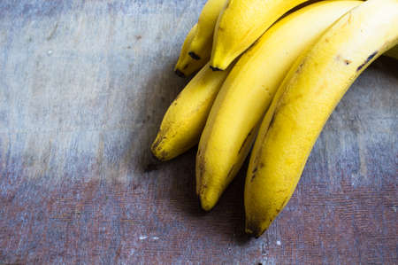 Fresh bananas on vintage wooden tableの写真素材