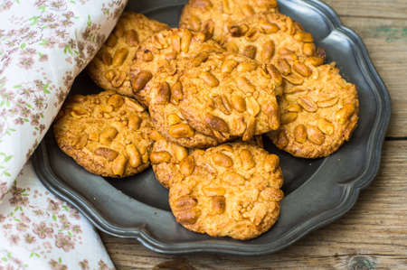Homemade Cookies with Macadamia nuts on vintage plate