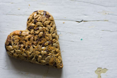 Eastern sweets: heart shaped baklava with the nuts, closeup of eastern sweet dessert