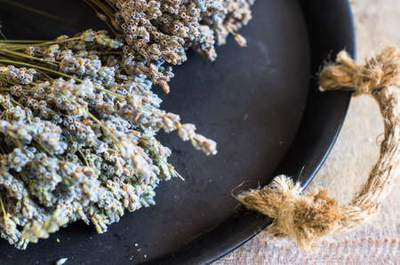 Bunch of lavender flowers on an old rustic wooden tableの写真素材