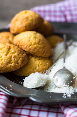 Sweet cookies on vintage plate on rustic wooden tableの写真素材