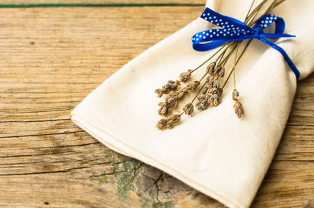 Rustic table setting with vintage plate and silverware with lavender