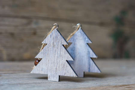 Wooden old-styled decorations for Christmas holidays on rustic backgroundの写真素材