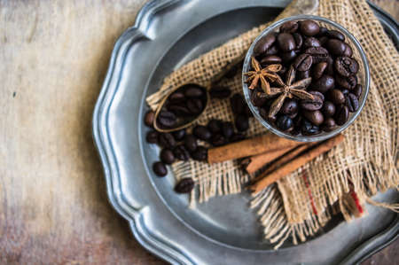 Coffee beans on rustic background