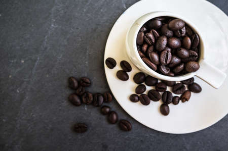 Coffee beans on rustic backgroundの写真素材