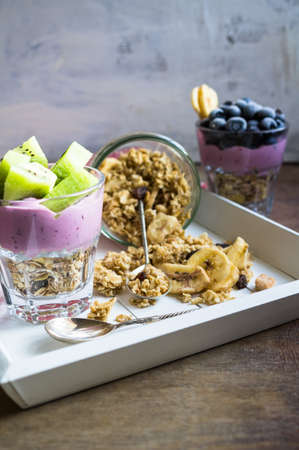 Healthy breakfast with oat flakes and fresh berries on rustic backgroundの写真素材