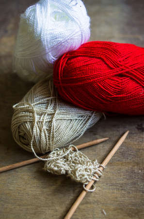 Vintage Knitting needles and yarn on wooden rustic tableの写真素材