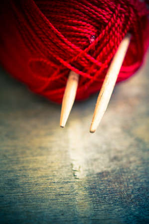 Vintage Knitting needles and yarn on wooden rustic table. Toned imageの写真素材