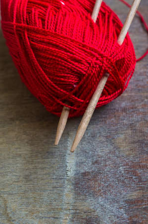 Vintage Knitting needles and yarn on wooden rustic tableの写真素材