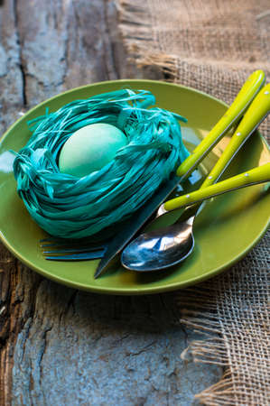 Table setting for Easter festive dinner with eggs and bunny