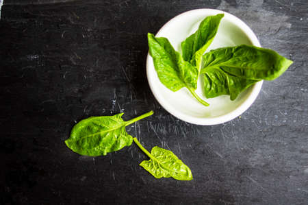 Healthy food with fresh ingredients for salad on rustic background