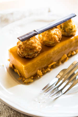 traditional european dessert on vintage porcelain plate onn rustic tableの写真素材