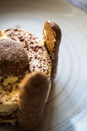 traditional european dessert on vintage porcelain plate onn rustic table