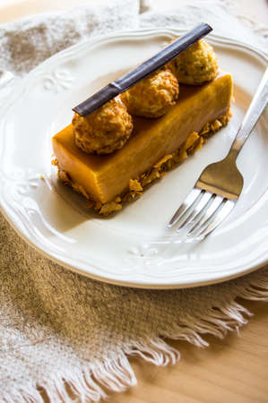 traditional european dessert on vintage porcelain plate onn rustic table