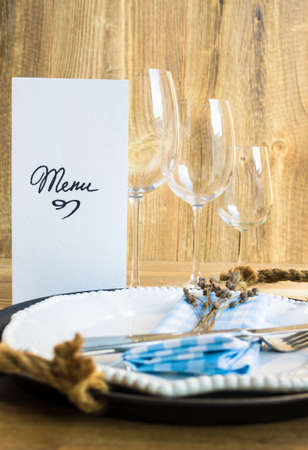 Table setting in rustic style with Menuの写真素材