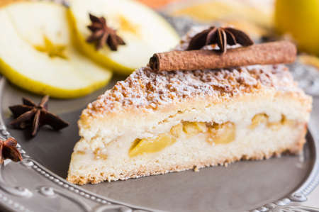 Apple pie with cinnamon and anise star spices on vintage plateの写真素材