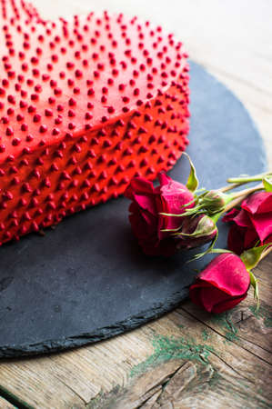 Red heat shaped chocolate cake for St. Valentines Day celebrationの写真素材