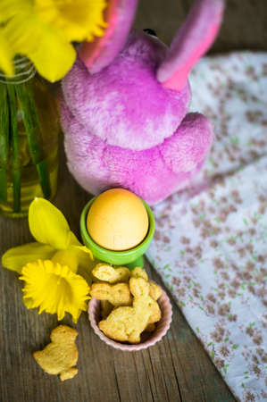 Rustic easter holiday concept with easter bunny and eggsの写真素材