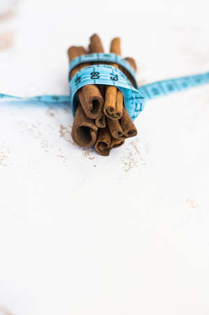 Cinnamon sticks and measure tape weight control conceptの写真素材