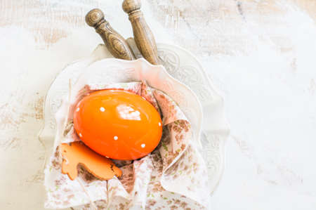 Table setting for Easter celebration with colorul easter eggs in vintage styleの写真素材