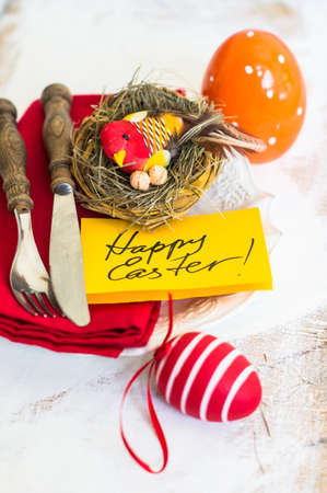 Table setting for Easter celebration with colorul easter eggs in vintage styleの写真素材