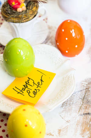 Table setting for Easter celebration with colorul easter eggs in vintage styleの写真素材