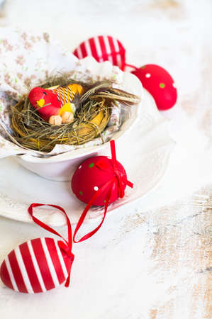 Table setting for Easter celebration with colorul easter eggs in vintage style