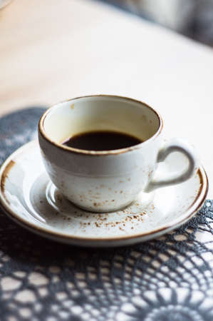 Cup of coffee on the table in cafeの写真素材