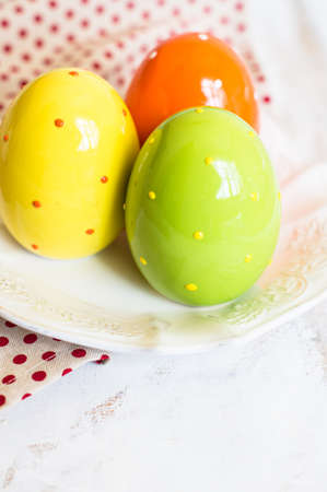 Table setting for Easter celebration with colorul easter eggs in vintage style