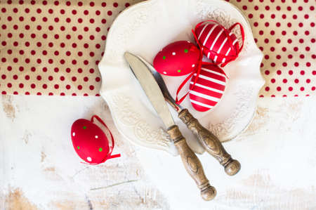 Table setting for Easter celebration with colorul easter eggs in vintage styleの写真素材