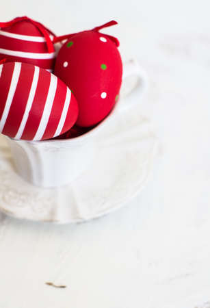 Table setting for Easter celebration with colorul easter eggs in vintage styleの写真素材