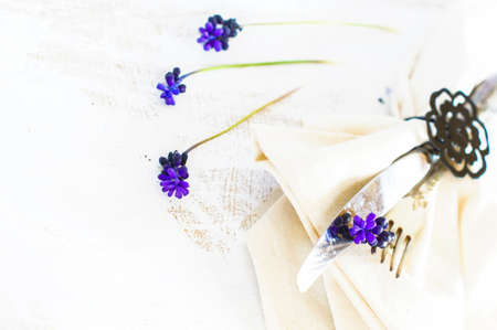Elegant spring table setting with delicate  muscari flowers. Selective focusの写真素材