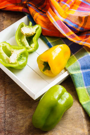 Diet concept with fresh bell pepper, silverware and measure tapeの写真素材