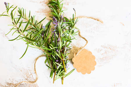 Fresh rosemary spice on rustic background as a cooking concept