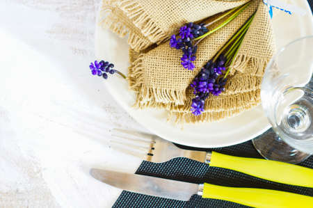Elegant spring table setting with delicate  muscari flowers. Selective focusの写真素材